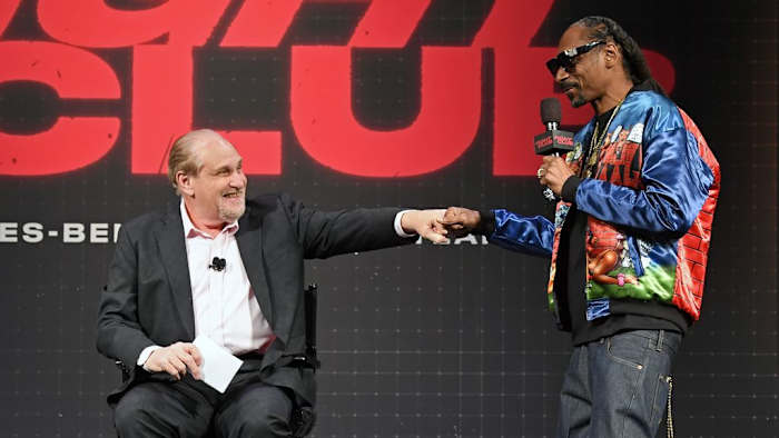 Announcer Al Bernstein (L) fist-bumps rapper Snoop Dogg during a news conference for Triller Fight Club's inaugural 2021 boxing event at The Venetian Las Vegas on March 26, 2021 in Las Vegas, Nevada. Photo by Ethan Miller/Getty Images